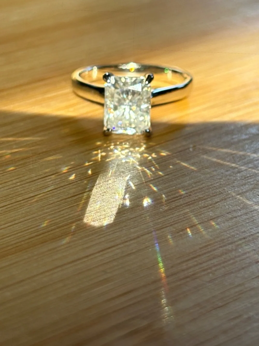 A certified 3ct radiant Moissanite solitaire in solid sterling silver and 18k!